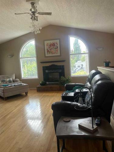 5112 52 Avenue, Consort, AB - Indoor Photo Showing Living Room With Fireplace