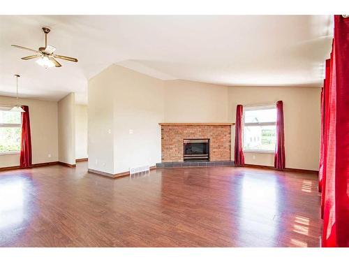 274030 Highway 53, Rural Ponoka County, AB - Indoor Photo Showing Living Room With Fireplace