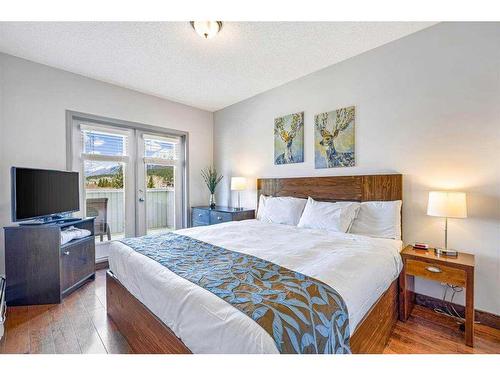 313-1151 Sidney Street, Canmore, AB - Indoor Photo Showing Bedroom