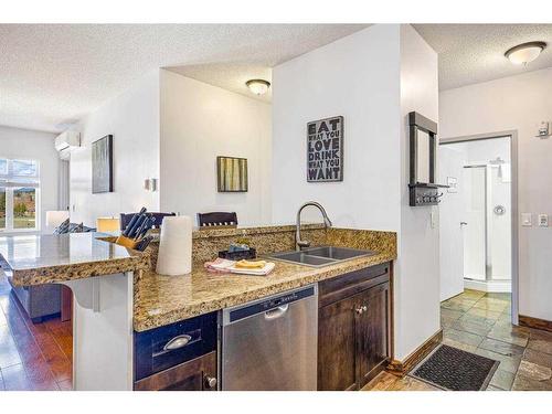 313-1151 Sidney Street, Canmore, AB - Indoor Photo Showing Kitchen With Double Sink