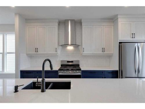 26 Edith Green Nw, Calgary, AB - Indoor Photo Showing Kitchen With Double Sink With Upgraded Kitchen