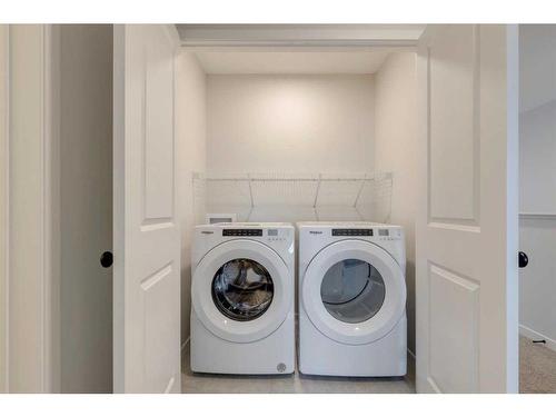 26 Edith Green Nw, Calgary, AB - Indoor Photo Showing Laundry Room