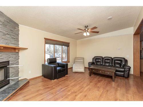 234-28302 Highway 12A, Rural Lacombe County, AB - Indoor Photo Showing Living Room With Fireplace