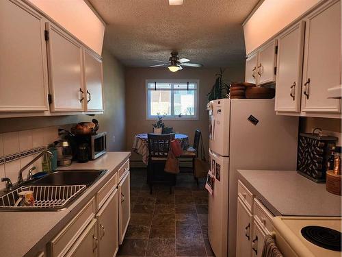 206-5812 61 Street, Red Deer, AB - Indoor Photo Showing Kitchen With Double Sink