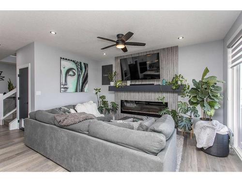 4175 Ryders Ridge Blvd, Sylvan Lake, AB - Indoor Photo Showing Living Room With Fireplace