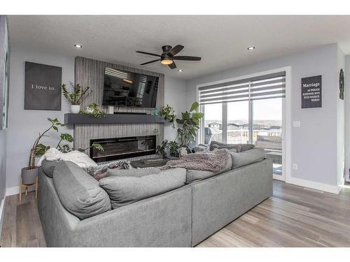 4175 Ryders Ridge Blvd, Sylvan Lake, AB - Indoor Photo Showing Living Room With Fireplace