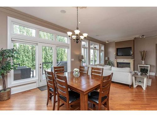 79 Alexander Crescent, Red Deer, AB - Indoor Photo Showing Dining Room With Fireplace