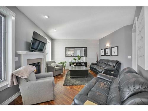 9 Ashmore Close, Red Deer, AB - Indoor Photo Showing Living Room With Fireplace