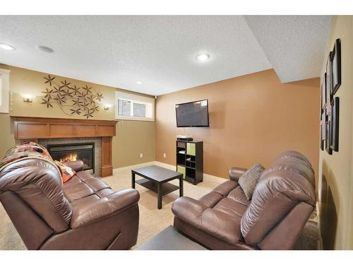 9 Ashmore Close, Red Deer, AB - Indoor Photo Showing Living Room With Fireplace