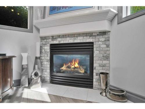 L01-6118 53 Avenue, Red Deer, AB - Indoor Photo Showing Living Room With Fireplace