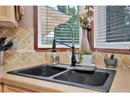 105 Dempsey Street, Red Deer, AB - Indoor Photo Showing Kitchen With Double Sink