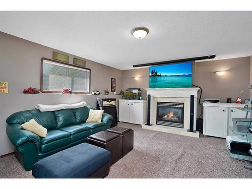 105 Dempsey Street, Red Deer, AB - Indoor Photo Showing Living Room With Fireplace