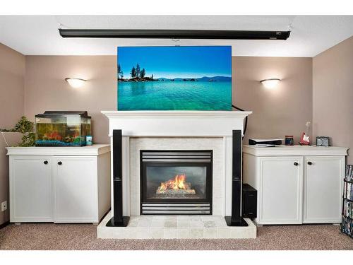 105 Dempsey Street, Red Deer, AB - Indoor Photo Showing Living Room With Fireplace