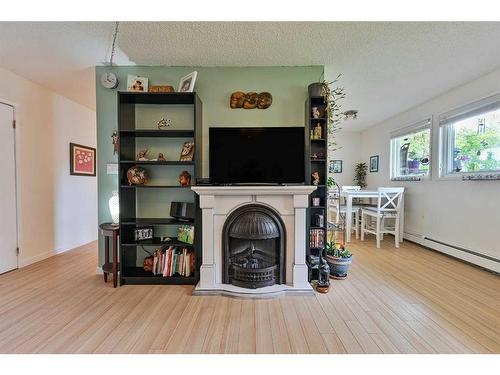 101-4814 46 Street, Red Deer, AB - Indoor With Fireplace