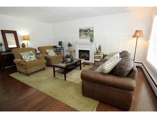 66 College Park Drive, Red Deer, AB - Indoor Photo Showing Living Room With Fireplace