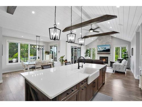 10 Sweetgrass Place, Sylvan Lake, AB - Indoor Photo Showing Kitchen With Fireplace With Upgraded Kitchen