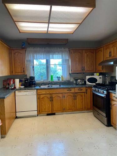 5018 Alexander Avenue, Coronation, AB - Indoor Photo Showing Kitchen With Double Sink