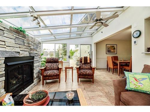 184 28342 Township Road 384, Rural Red Deer County, AB - Indoor Photo Showing Living Room With Fireplace