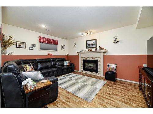 184 28342 Township Road 384, Rural Red Deer County, AB - Indoor Photo Showing Living Room With Fireplace