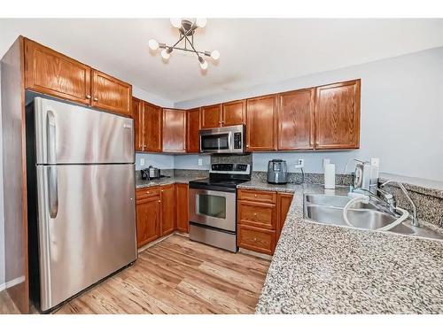 143 Lanterman Close, Red Deer, AB - Indoor Photo Showing Kitchen With Double Sink