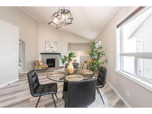 28 Vincent Close, Red Deer, AB - Indoor Photo Showing Dining Room With Fireplace