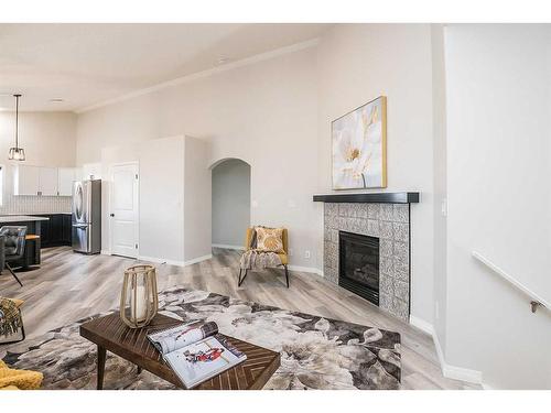 28 Vincent Close, Red Deer, AB - Indoor Photo Showing Living Room With Fireplace