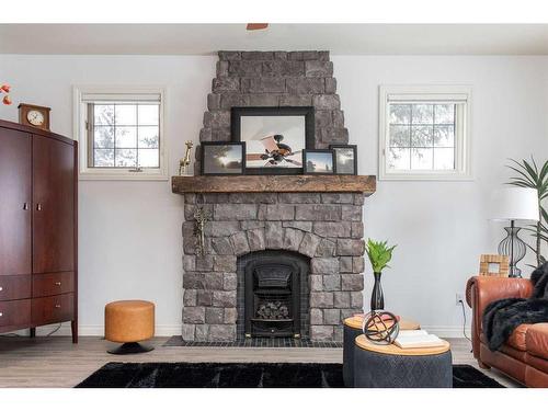 217-27111 Highway 597, Rural Lacombe County, AB - Indoor Photo Showing Living Room With Fireplace