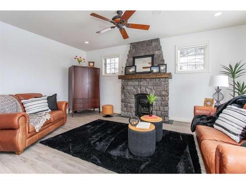 217-27111 Highway 597, Rural Lacombe County, AB - Indoor Photo Showing Living Room With Fireplace