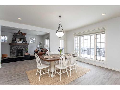 217-27111 Highway 597, Rural Lacombe County, AB - Indoor Photo Showing Dining Room With Fireplace