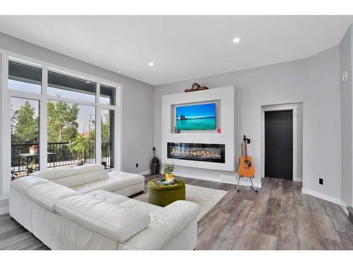 11 Cole Way, Sylvan Lake, AB - Indoor Photo Showing Living Room With Fireplace