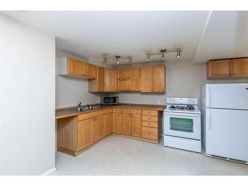 69 Nagel Avenue, Red Deer, AB - Indoor Photo Showing Kitchen With Double Sink