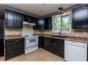 69 Nagel Avenue, Red Deer, AB  - Indoor Photo Showing Kitchen With Double Sink 