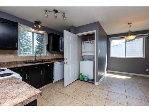 69 Nagel Avenue, Red Deer, AB - Indoor Photo Showing Kitchen With Double Sink