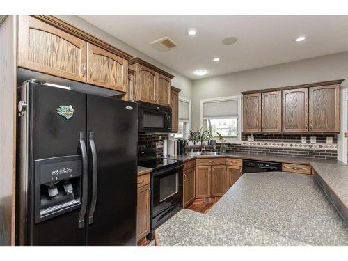 110-150 Vanier Drive, Red Deer, AB - Indoor Photo Showing Kitchen With Double Sink