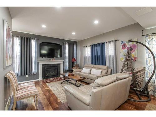 110-150 Vanier Drive, Red Deer, AB - Indoor Photo Showing Living Room With Fireplace