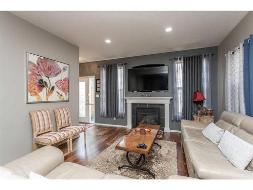 110-150 Vanier Drive, Red Deer, AB - Indoor Photo Showing Living Room With Fireplace