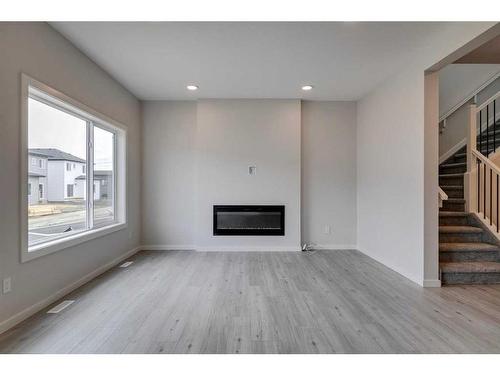 65 Emmett Crescent, Red Deer, AB - Indoor Photo Showing Living Room With Fireplace