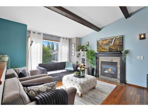 8 Archibald Crescent, Red Deer, AB - Indoor Photo Showing Living Room With Fireplace