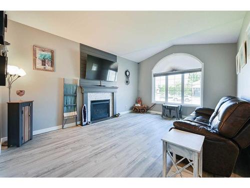 112 Archer Drive, Red Deer, AB - Indoor Photo Showing Living Room With Fireplace