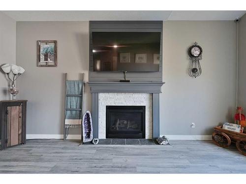 112 Archer Drive, Red Deer, AB - Indoor Photo Showing Living Room With Fireplace