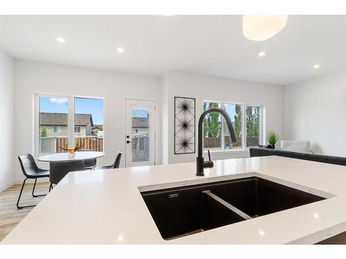 74 Palmer Circle, Blackfalds, AB - Indoor Photo Showing Kitchen With Double Sink