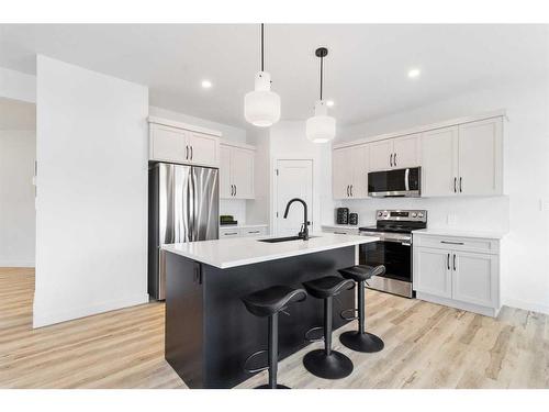 74 Palmer Circle, Blackfalds, AB - Indoor Photo Showing Kitchen With Stainless Steel Kitchen With Upgraded Kitchen