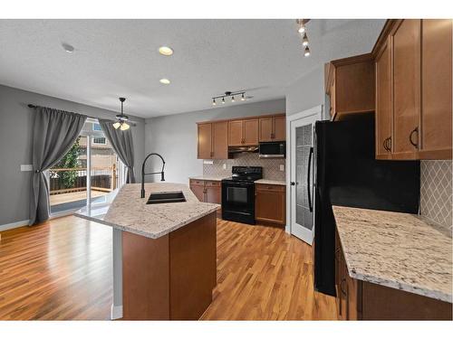 7512 38A Avenue, Camrose, AB - Indoor Photo Showing Kitchen With Double Sink