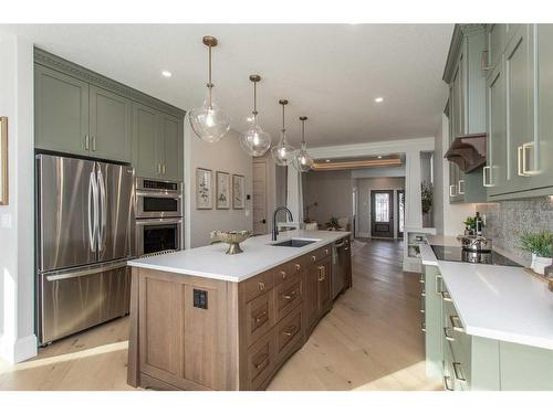 7 Songbird Green, Sylvan Lake, AB - Indoor Photo Showing Kitchen With Stainless Steel Kitchen With Upgraded Kitchen