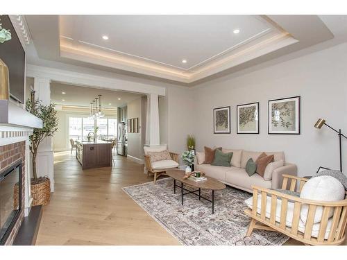 7 Songbird Green, Sylvan Lake, AB - Indoor Photo Showing Living Room With Fireplace