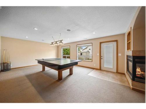 69 Alberts Close, Red Deer, AB - Indoor Photo Showing Other Room With Fireplace