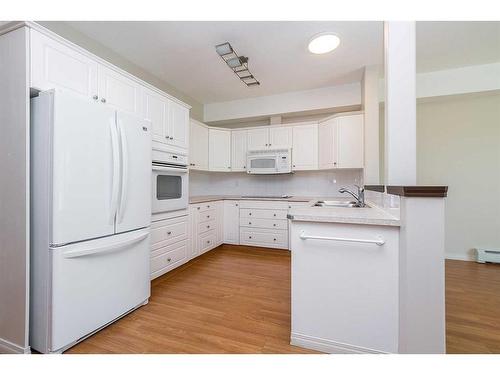 226-5300 48 Street, Red Deer, AB - Indoor Photo Showing Kitchen With Double Sink