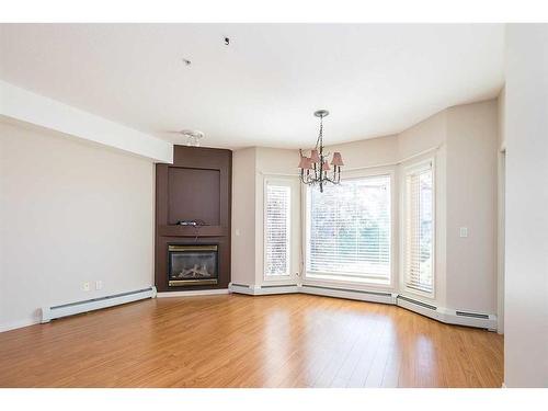 226-5300 48 Street, Red Deer, AB - Indoor Photo Showing Living Room With Fireplace