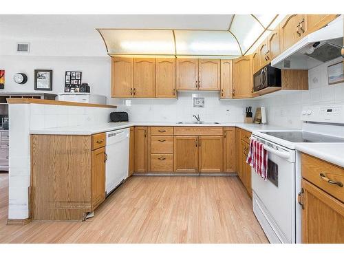 130-4805 45 Street, Red Deer, AB - Indoor Photo Showing Kitchen With Double Sink