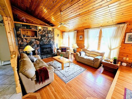 916 & 920 6 Street Se, Slave Lake, AB - Indoor Photo Showing Living Room With Fireplace